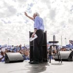 Bernie Sanders speaking at outdoor rally