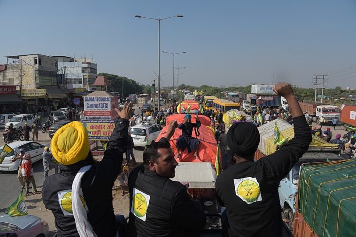2020 Indian farmers' protest - On a truck. Photo CC0 1.0 Universal Public Domain by Randeep Maddoke, randeepphotoartist@gmail.com.