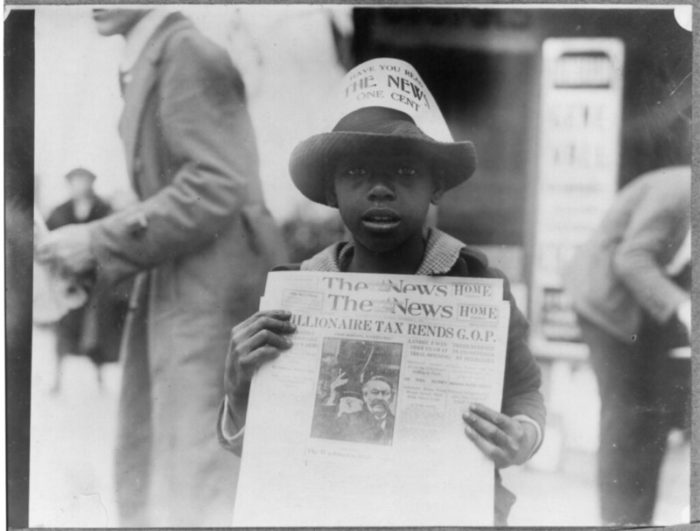 "LC-USZ62-69050 African Amercian Newspaper Boy 1921" by Children's Bureau Centennial is licensed under CC BY 2.0