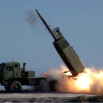 The High Mobility Artillery Rocket System fires the Army's new guided Multiple Launch Rocket System during testing at White Sands Missile Range. 11 January 2005. US Army photo. Public Domain.
